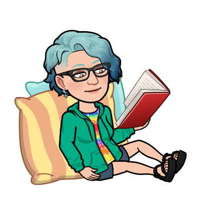 Cartoon person with short blue hair and glasses, wearing a green hoodie and rainbow shirt, sitting on cushions and reading a book.